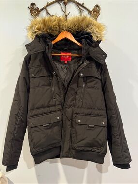 Guess men’s Dustin Puffer Jacket with multi-pockets detachable fur-lined hood.